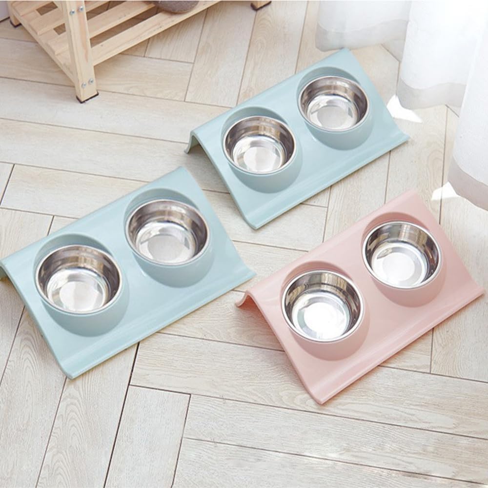 Three pet bowls on elevated stands in pastel colors on a light wooden floor at Pet Servo