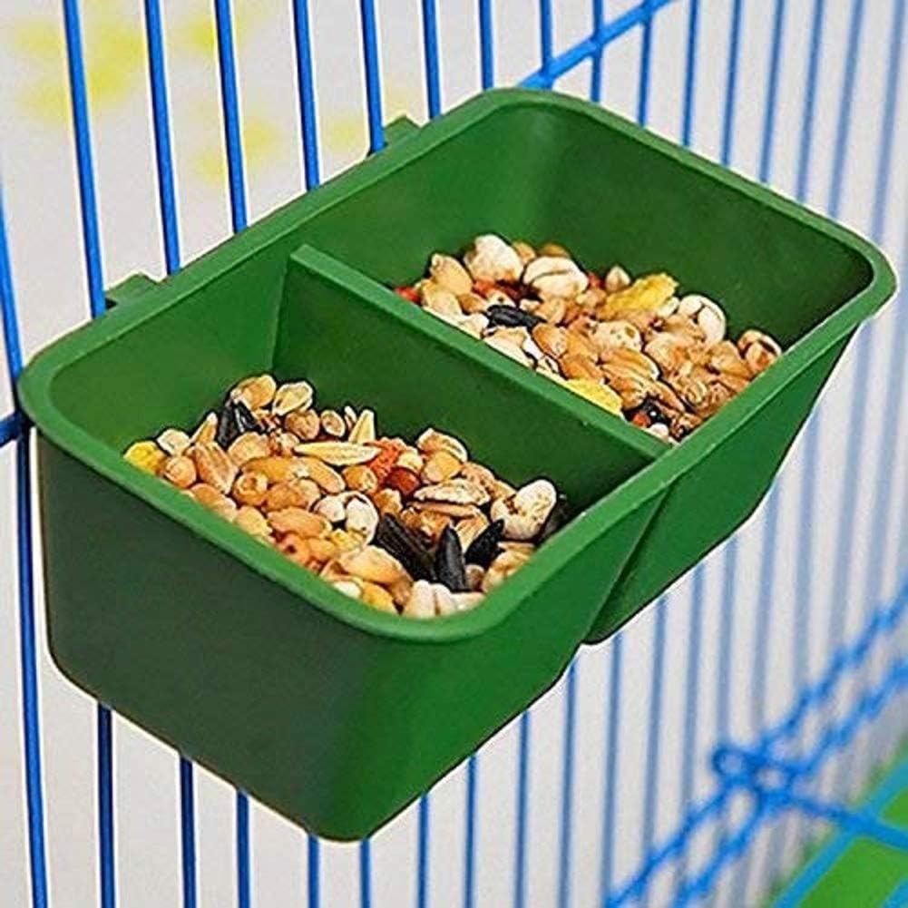Green bird feeder with seeds inside, attached to a cage at Pet Servo