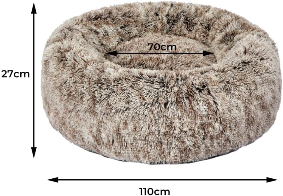 A fluffy circular pet bed in a mottled brown and beige faux fur material, shown with dimension arrows and labels indicating a height of 27cm, width of 70cm, and inner diameter of 40cm on a white background at Pet Servo