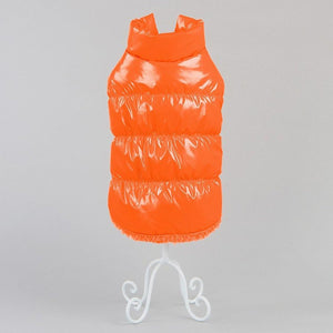 Orange puffer vest on a gray background at Pet Servo