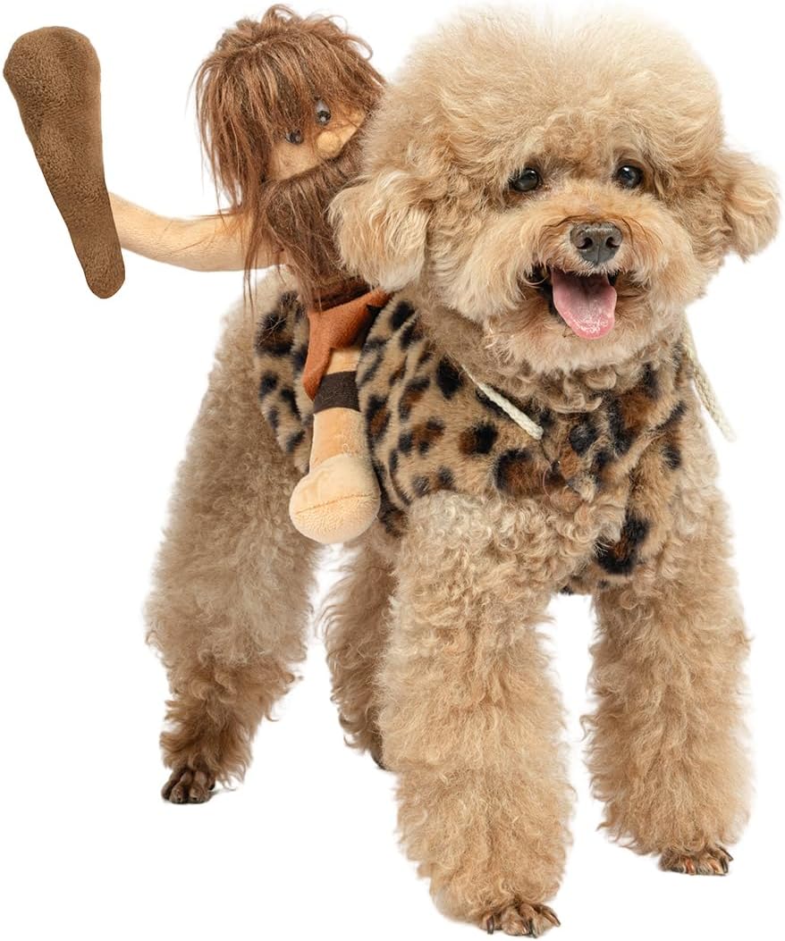 A fluffy light tan dog wearing a leopard-print pet costume with a plush doll riding on its back, photographed against a plain white background.