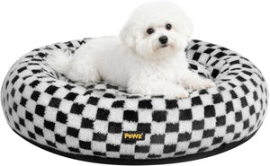 Small white dog sitting on a black and white checkered pet bed with 'Pawz' branding at Pet Servo