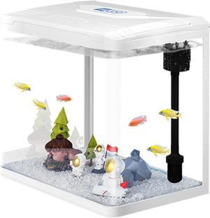 Small aquarium with fish, decorations, and a power filter on a white background