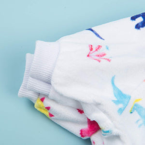 Colorful socks with cartoon designs on a light blue background at Pet Servo