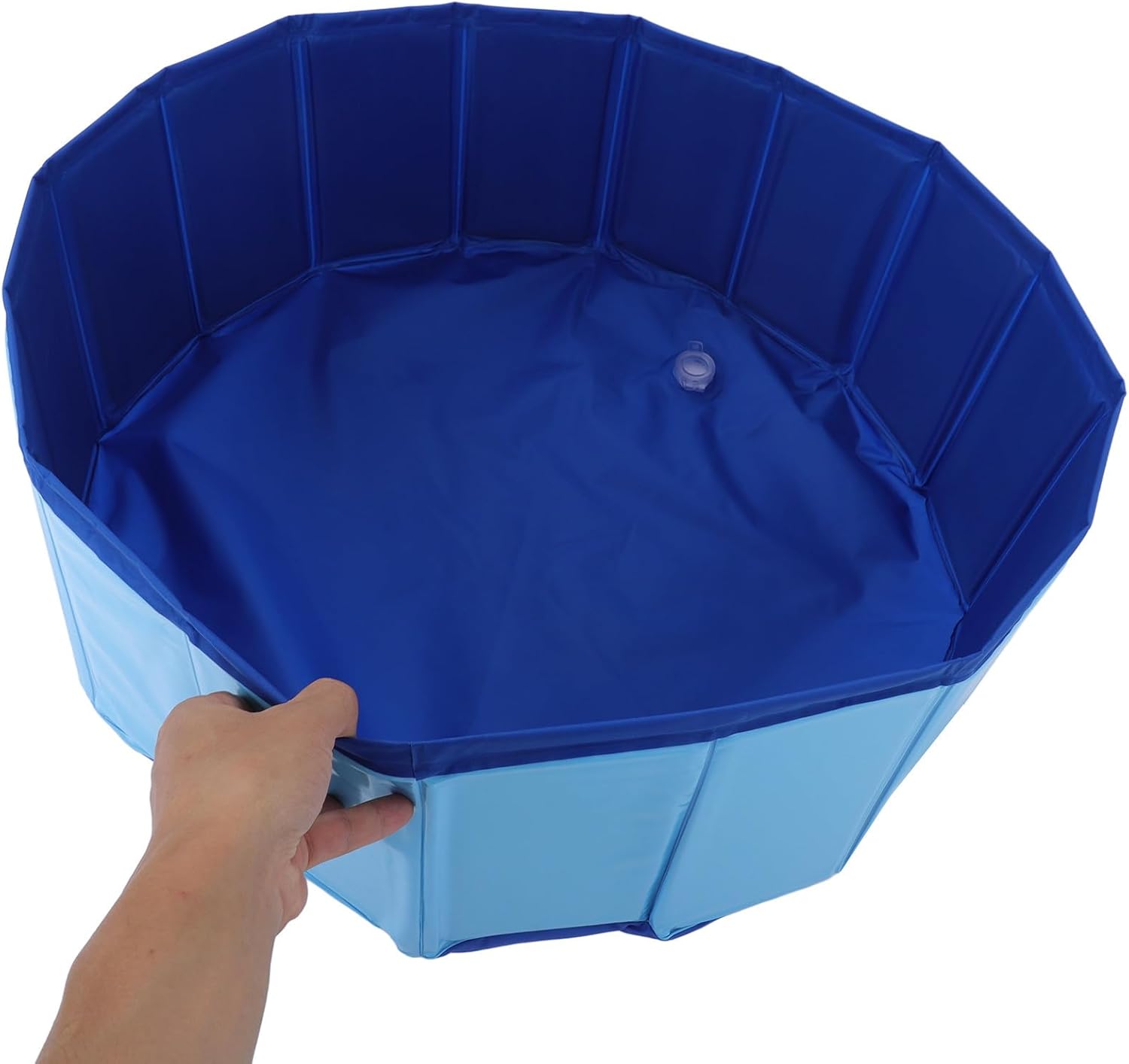 Blue octagonal pool with a hand holding one of its sides on a white background at Pet Servo