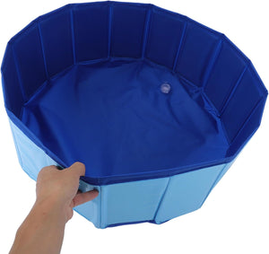 Blue octagonal pool with a hand holding one of its sides on a white background at Pet Servo
