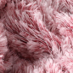 Close-up of pink fluffy fabric texture at Pet Servo