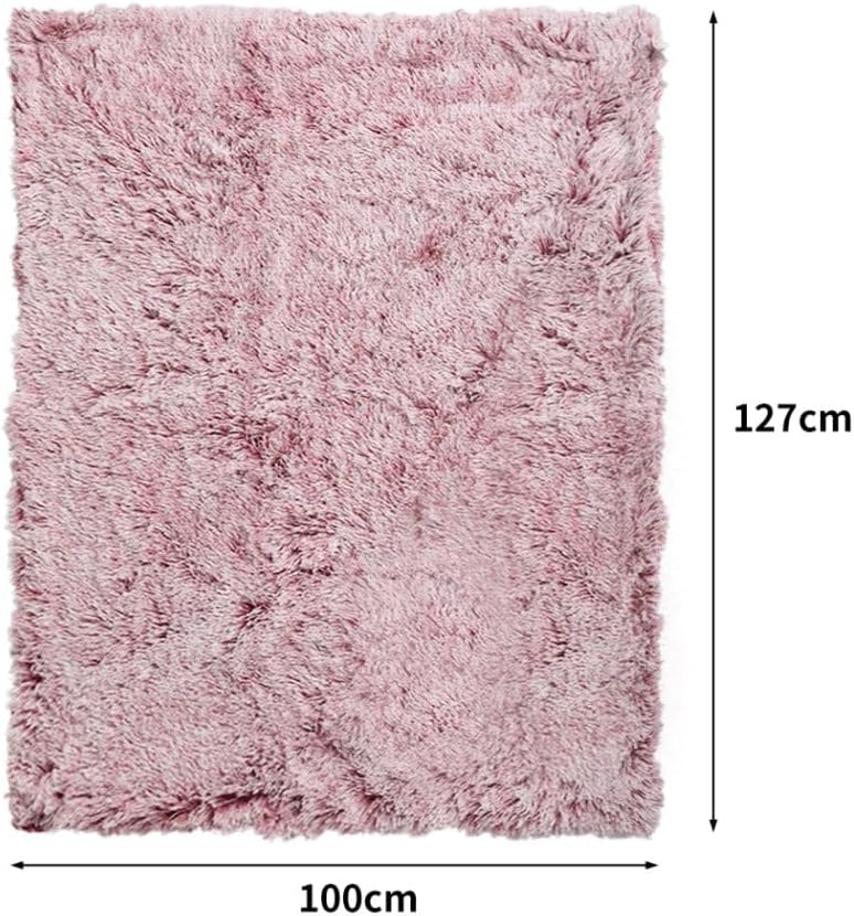 A pink shaggy rectangular rug with dimension markers showing 127cm height and 100cm width on a white background at Pet Servo