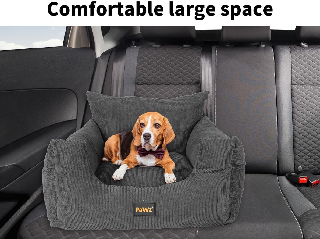 Dog sitting on a gray pet seat in a car with 'Pawz' branding at Pet Servo
