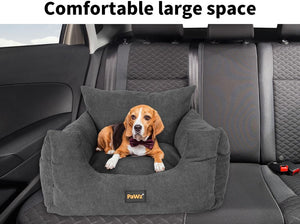Dog sitting on a gray pet seat in a car with 'Pawz' branding at Pet Servo