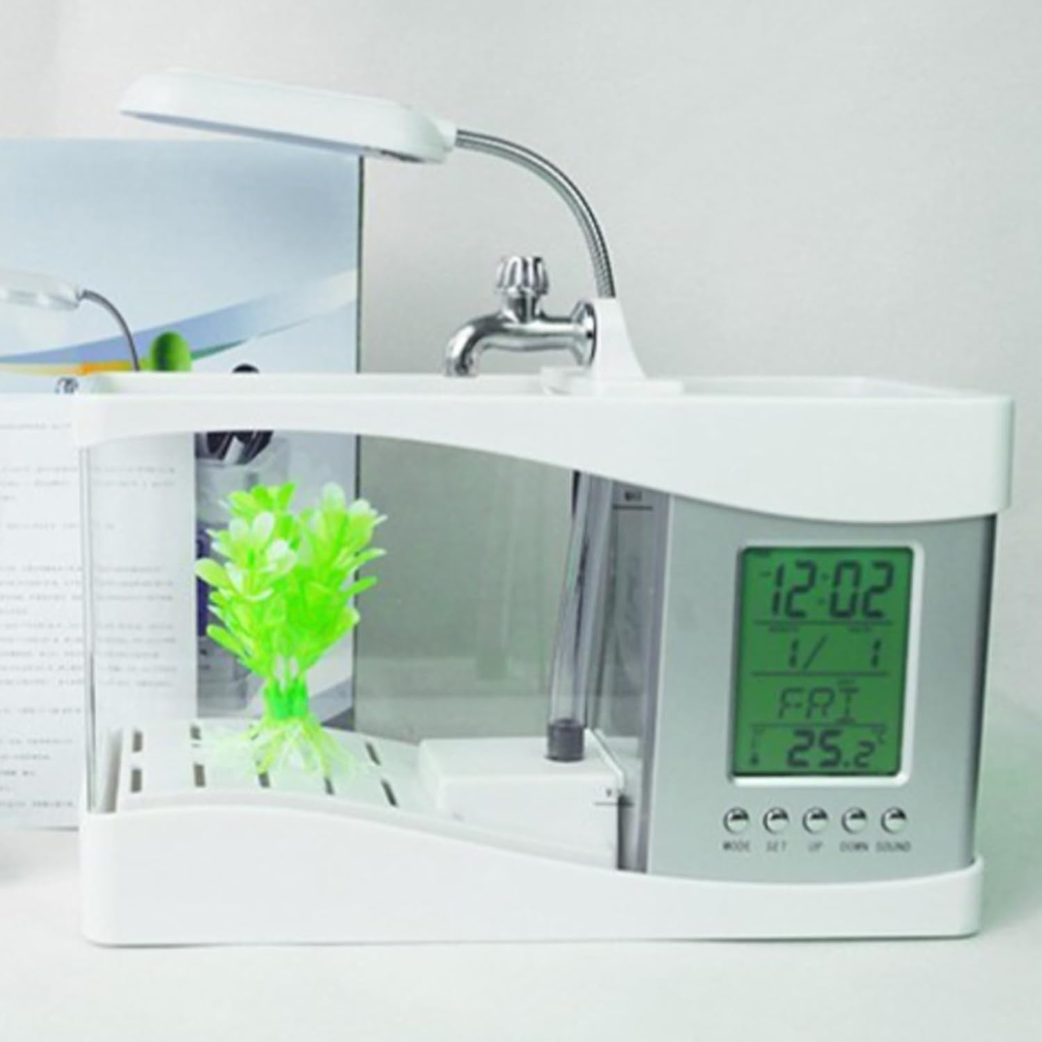 White electronic device with digital display and plant on a white background at Pet Servo