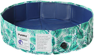 Collapsible pet pool with tropical leaf design and warning label on a white background at Pet Servo