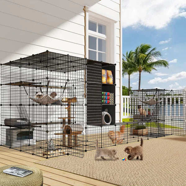 Large black pet playpen with multiple levels and accessories on a patio at Pet Servo.