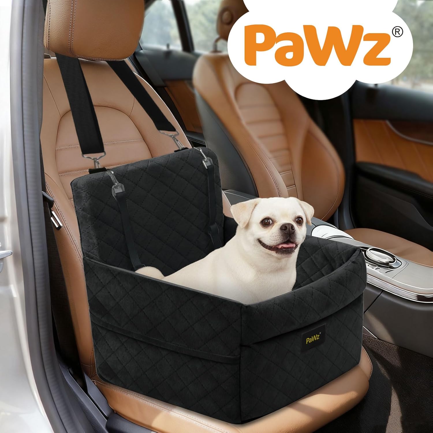 Dog sitting in a black car seat booster in a vehicle with 'PaWz' branding at Pet Servo