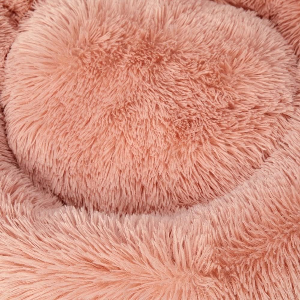 Close-up of a pink fluffy fabric texture at Pet Servo