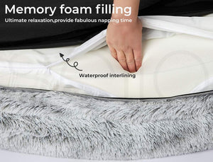 Memory foam mattress topper with waterproof interlining, showing a hand pressing down on it at Pet Servo