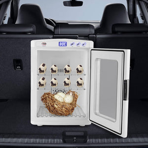 A compact white egg incubator shown open inside the trunk of a car, with multiple eggs on racks and a nest of eggs at the bottom. The incubator door is open to the right, and the car trunk and seats are visible in the background.