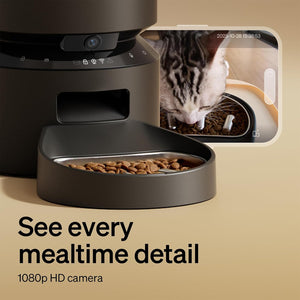 Pet feeder with 1080p HD camera displaying a cat eating, on a beige background.