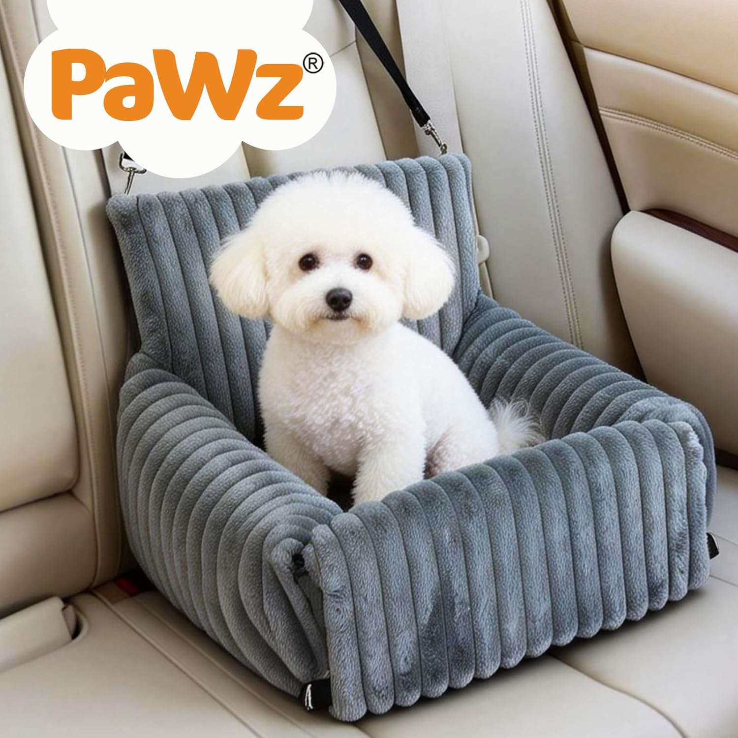 Dog sitting in a gray car seat with 'PaWz' branding on a beige car interior at Pet Servo
