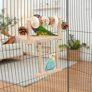 Birds on a wooden perch inside a birdcage with a blurred indoor background at Pet Servo