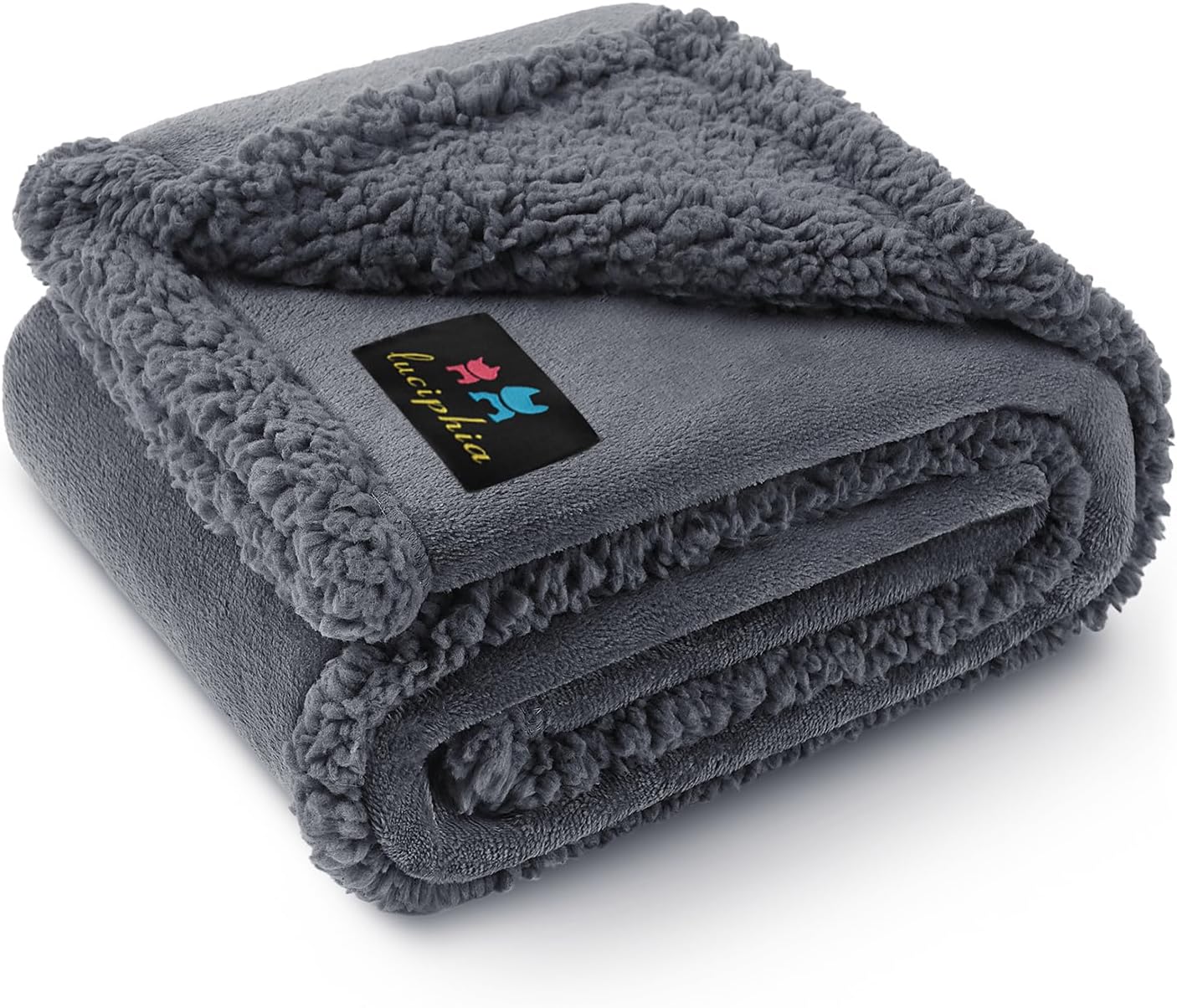 Folded gray sherpa blanket with a brand logo on a white background