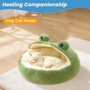 Green frog-shaped cat house with a cat inside on a wooden floor at Pet Servo