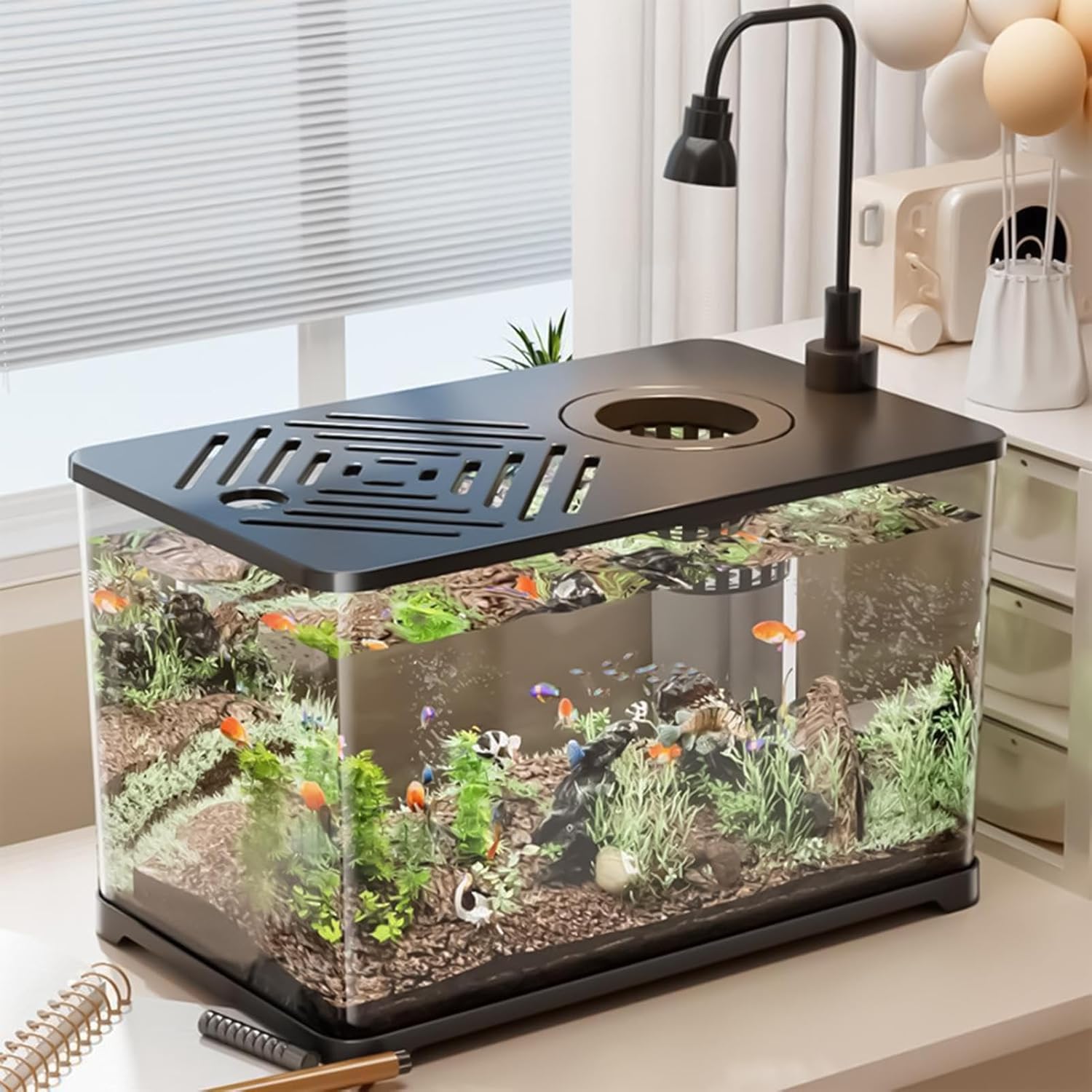 Fish tank with aquatic plants and fish on a desk at Pet Servo