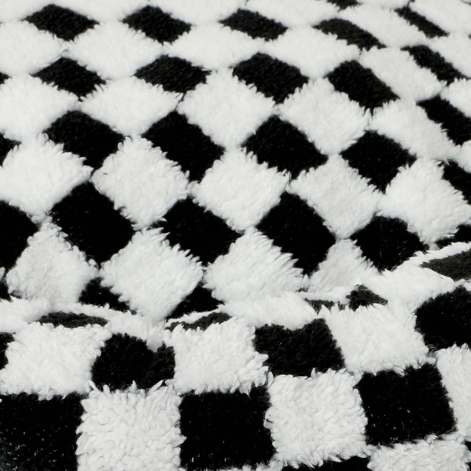 Close-up of a black and white checkered pattern fabric at Pet Servo