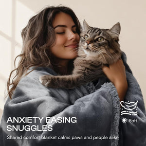 Woman holding a cat wrapped in a blanket with text about anxiety easing snuggles.