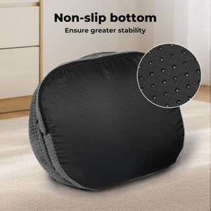 Black and gray cushion with non-slip bottom feature on a light wooden floor at Pet Servo