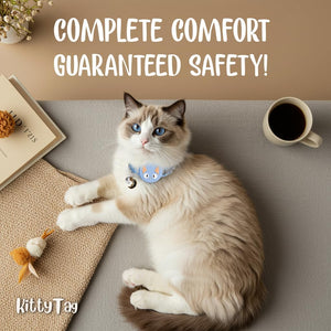 Cat wearing a collar with a tag, lying on a couch next to a coffee cup and toy, with text 'Complete comfort guaranteed safety!' and 'KittyTag' branding at Pet Servo