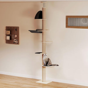 A tall cat tree with a beige column and multiple platforms, shown in a room with a gray tabby cat sitting on one of the lower platforms. The wall is beige with a wooden vent and a small shelf on the left at Pet Servo