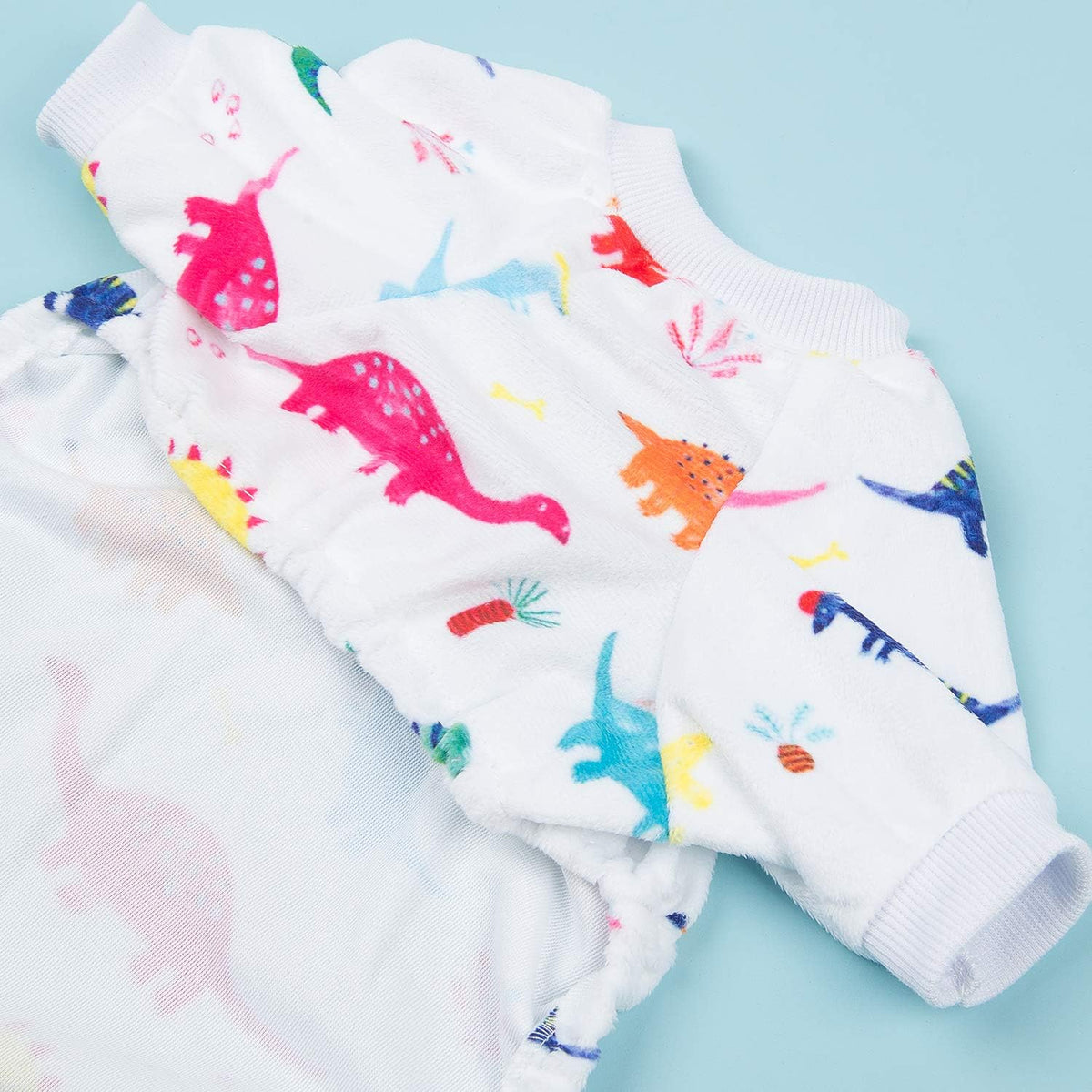 Children's leggings with colorful dinosaur pattern on a light blue background at Pet Servo