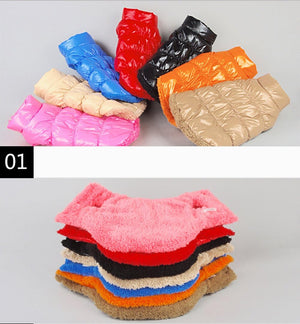 Stacks of colorful puffer jackets on a gray background at Pet Servo