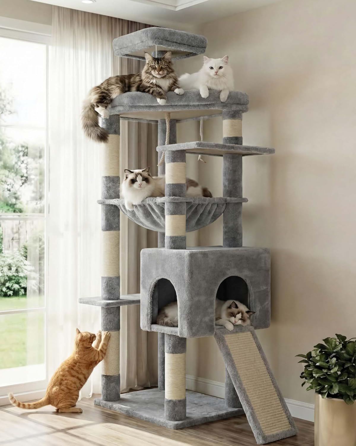 Gray cat tree with multiple cats on different levels in a room with a window and plant at Pet Servo