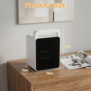 A small white and black portable heater or fan sits on a wooden table in a styled room setting, with overlaid dimension labels showing 10 cm, 15 cm, and 21 cm product size.