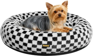 Small dog lying on a black and white checkered pet bed with 'Pawz' branding at Pet Servo