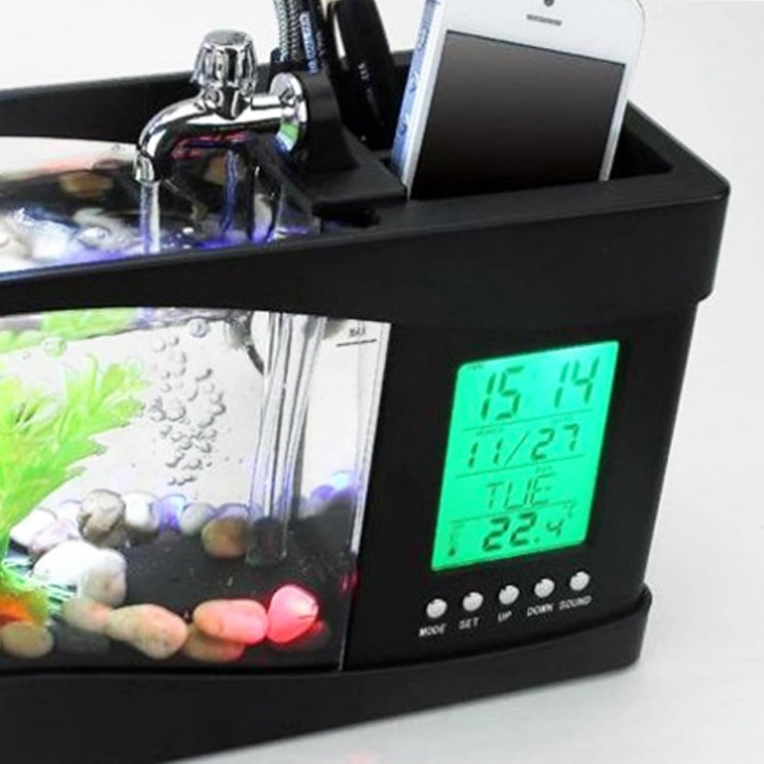 Black electronic desk organizer with fish tank, phone, and digital clock display at Pet Servo