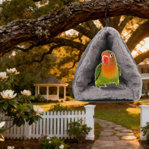 Bird perched in a gray hanging bird house with a garden background at Pet Servo