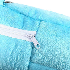 Close-up of a blue fabric with a white zipper at Pet Servo