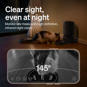 Cat eating from a bowl with a camera displaying the view, text about night vision, and a blurred background.