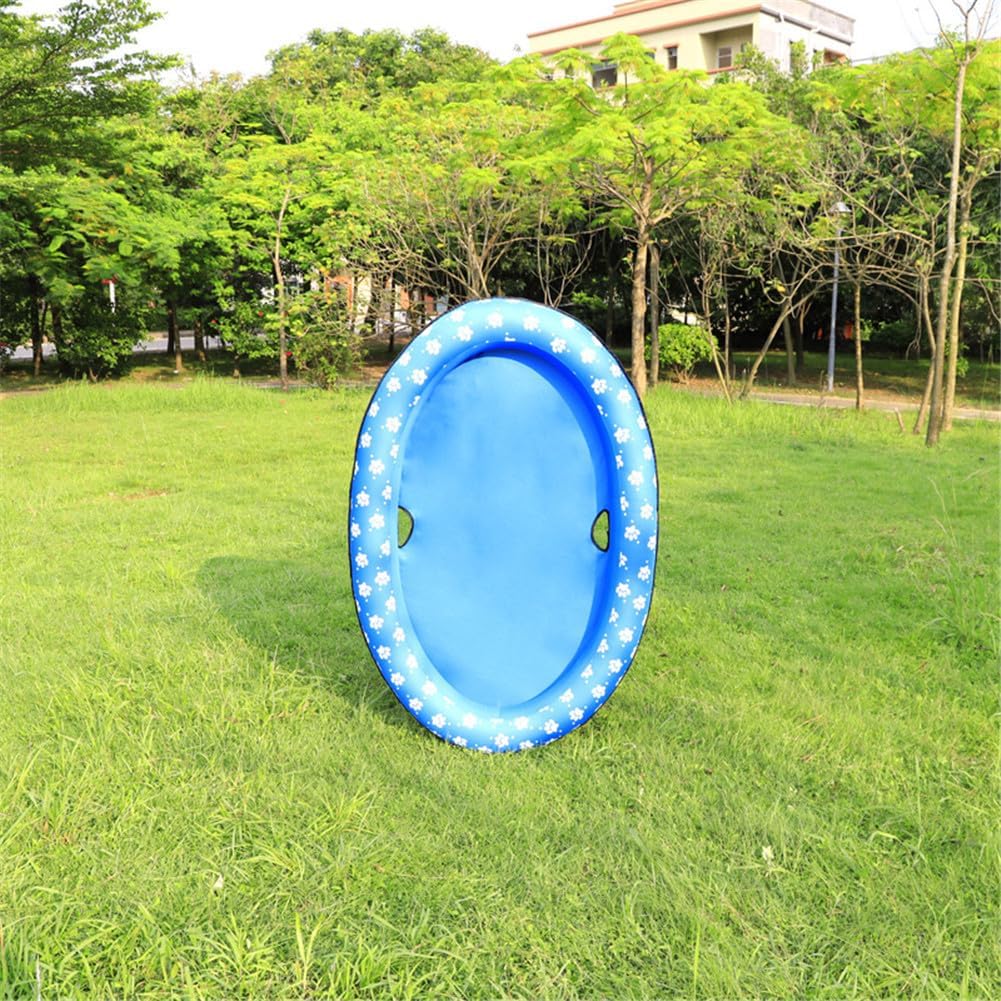 Blue inflatable ring on grass with trees and buildings in the background at Pet Servo