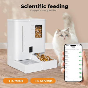 A white automatic pet feeder with a food window and dispensing tray, shown on a wooden floor with a white cat standing beside it and a hand holding a smartphone displaying a scheduling app. Text at the top reads 'Scientific feeding' and orange badges say '1-15 Meals' and '1-15 Servings' at Pet Servo