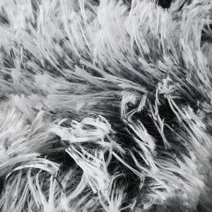 Close-up of a shaggy faux fur fabric texture in black and white, showing the fluffy fibers and soft material detail at Pet Servo