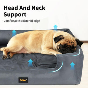 Dog lying on a gray pet bed with 'PaWz' branding, highlighting head and neck support at Pet Servo