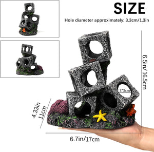 Decorative aquarium rocks with measurements and a hand holding them for scale at Pet Servo