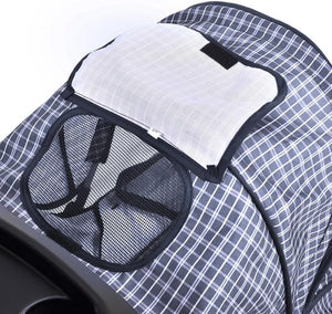 Close-up of a stroller canopy with a blue and white grid pattern, featuring a white mesh sun shield and a black mesh side pocket at Pet Servo