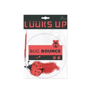 A packaged pet toy labeled 'LOOKS UP BUG BOUNCE' on a white background. The toy includes a red ladybug-shaped item with black spots, a red feather, and a red-and-black wand at Pet Servo