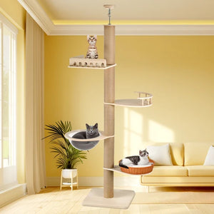 A tall multi-level cat tree with a sisal-wrapped pole, white platforms, a gray cat bed, and a woven orange cat bed, shown in a bright living room with two cats resting on it at Pet Servo