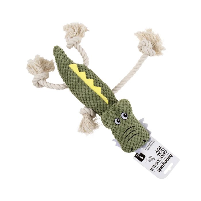 A green crocodile-shaped dog toy made of knitted fabric with beige rope tails and a yellow back detail, shown on a white background with a product tag attached.
